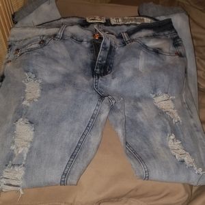 Light/dark blue distressed jeans with ankle cuff